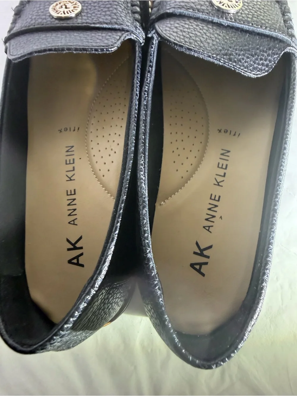 Anne Klein Black Textured Leather Loafers with Gold Emblem